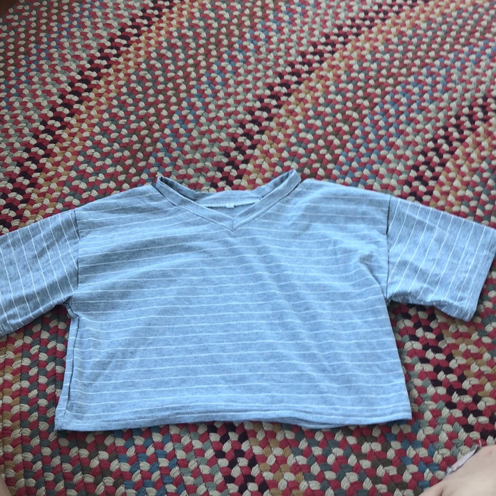 Crop top with slits at the neck.